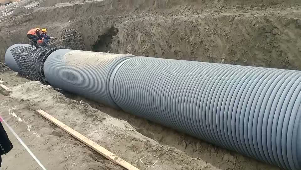 Frame from large-diameter pipe installation footage